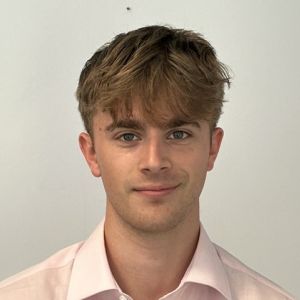 Samuel Lantos, trainee solicitor at DHC, wearing a pale shirt. 